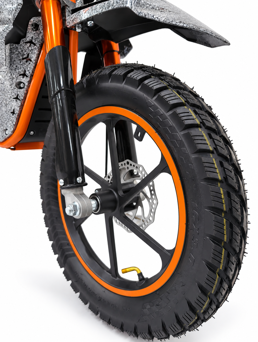 AK7 GTM 3 Orange kids electric dirt bike – front tyre, wheel and fork close-up on a white studio background